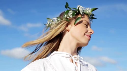 Blonde Woman with Flower Crown Enjoys Sunny Day