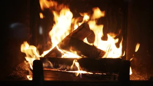 Heating, Warmth, Fire and Cosiness Concept - Close Up of Firewood Burning