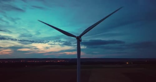 Aerial View Wind Turbines Generate Renewable Energy at Night Silhouettes of Windmills with Bright