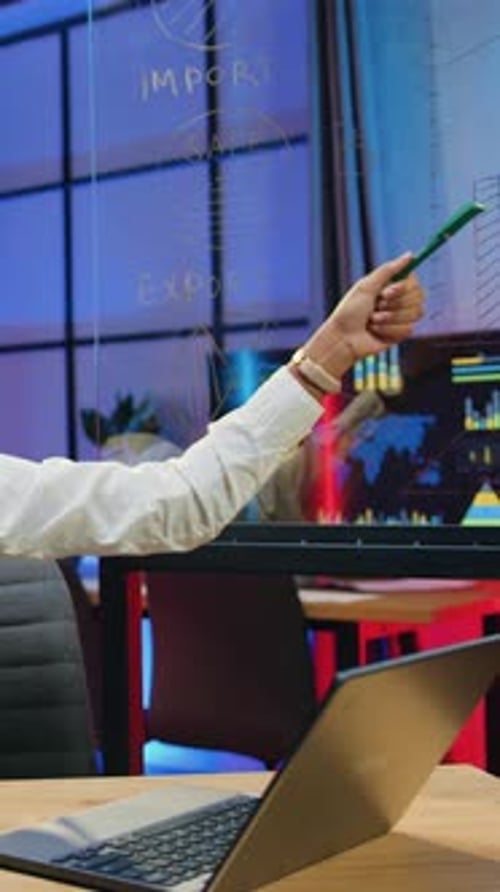 Confident Woman Explaining Data on Glass Board