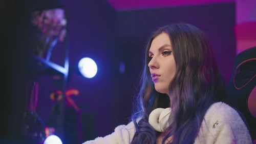 Woman Eating Popcorn While Gaming with Blue Hair