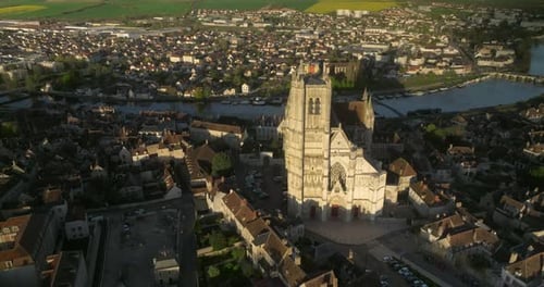 Helicopter Flight Over the Ancient French City Near the River Medieval City at Sunset From a Drone