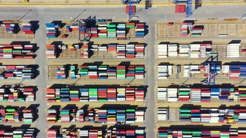 Container ship in export and import business and logistics. Shipping cargo to harbor by crane. Water