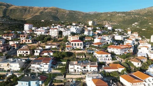 Albanian Riviera Coastal Town of Himare, Albania - Aerial Pullback Reveal Shot