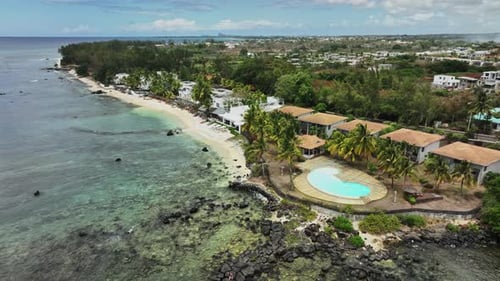 An aerial view of a resort on a tropical island