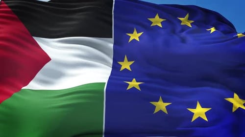 Palestine and European Union Flags Waving Against Blue Sky