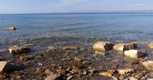Crystal clear water of the Adriatic Sea and Moon Bay beach in Piran, Slovenia.