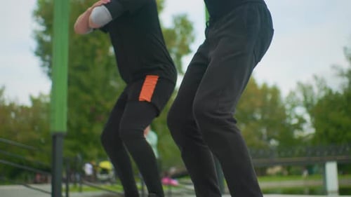 Casual Morning Training Outdoors Amidst Trees and City Elements Athlete Performing Controlled Deep