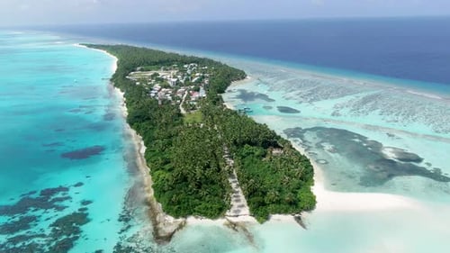 Aerial view of tropical island and ocean, Maldives.