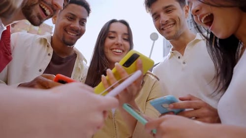 Caucasian Girl Looking at Happy Cell Phone Low Angle View of Group Friends Addicted to Technology