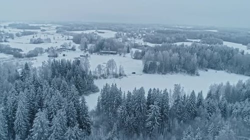 Aerial View of Snow Covered Rural Winter Landscape