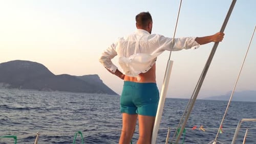 Young Man Admire View While Sailing Boat on Sea 30s
