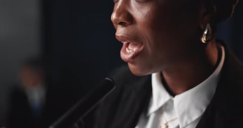 Adult Woman Giving Corporate Speech at Podium
