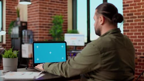 Startup Employee Analyzing Business Charts and Greenscreen