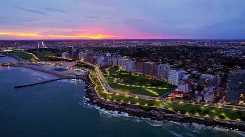 Aerial Approaching of Waterfront Park in Mar Del Plata City at Sunset, Argentina