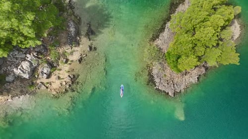 Aerial View Scenic Paddleboarding Journey in a Lush Green Canyon
