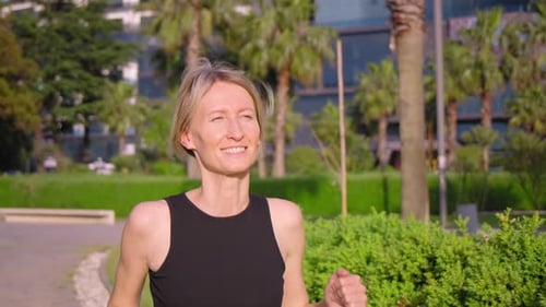 Woman jogging road summer park sports caucasian female morning exercise