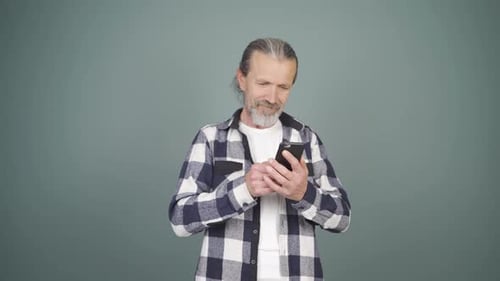 The phone of the man talking on the phone runs out of charge.