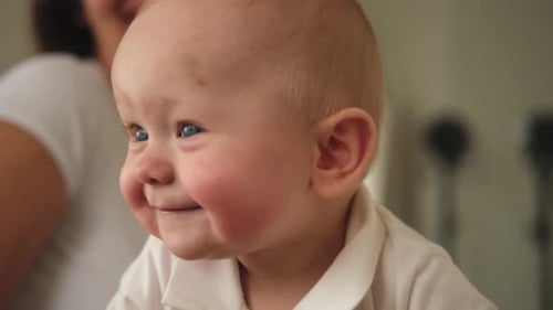 Happy Baby Cute Little Newborn Girl with Smiling Face Crawling on Couch in Bedroom Emotional Infant