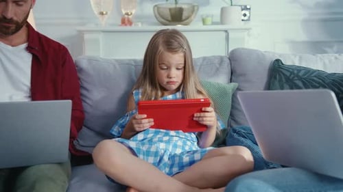 A Child Engaged in Tablet Use at Home Exploring Digital Worlds and Creative Opportunities
