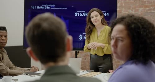 Businesswoman Presenting in Office during Meeting