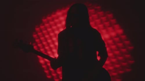 Young Performer Giving Indie Rock Concert in Studio