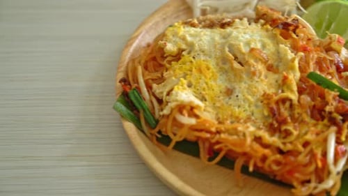 Pad Thai Noodles with Fried Egg on Plate