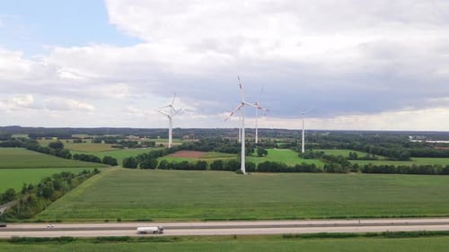 Wind turbines next to highway
