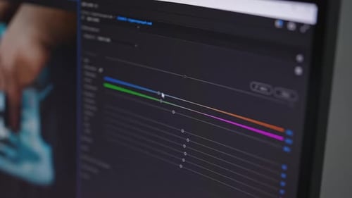Closeup of Video Maker Editing Movie Making Color Correction Using Modern Software App Program