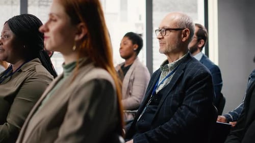 Diverse Group Listens to Speaker at Conference