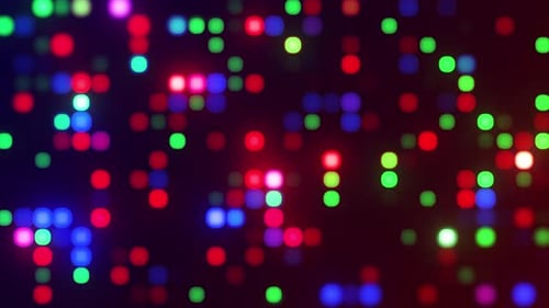 Bright glowing Christmas lights background. Blue, red and green LED lights creating a flicker wall.