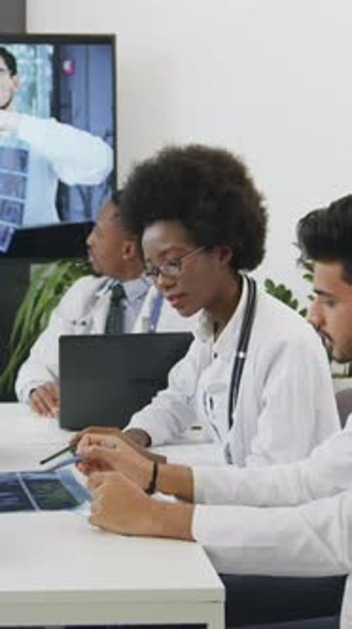 Team of Doctors Meeting About X-Ray Results