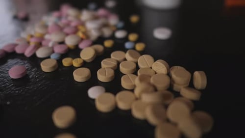 Closeup of Pills on a Black Table
