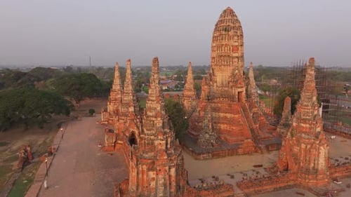Aerial glimpse of temple ruins under golden sky, Ayutthaya