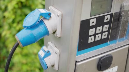 Charging Station Equipped with Blue Connectors Designed Specifically for Electric Vehicles