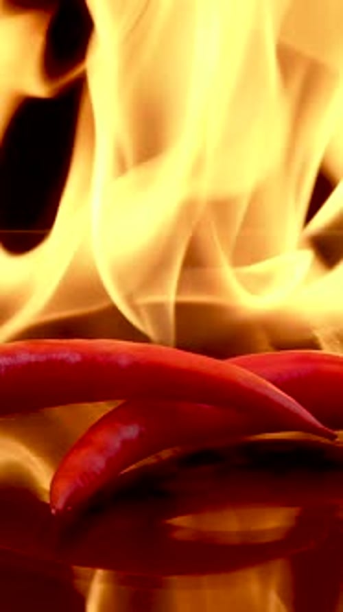 Red Chili Peppers in a Fiery Backdrop