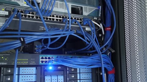 Data Center Server Rack with Interconnected Blue Network Cables