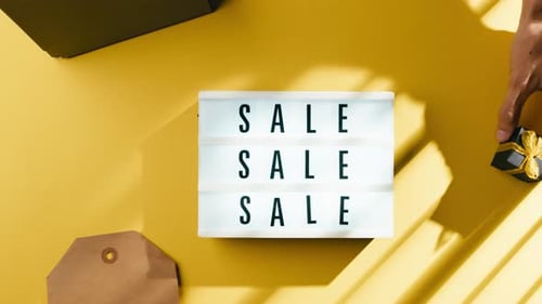 Overhead Flat Lay of Sale Sign with Gifts