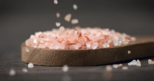 Falling Pink Himalayan Salt on Wooden Spoon