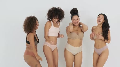 Confident Young Women Dancing Happily in Studio