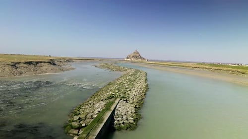 a view of Monte Saint Michel from the top of the river - tracking dolly