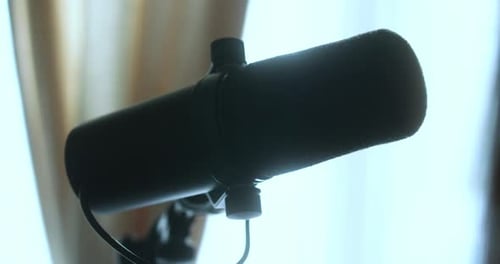 Famous Shure microphone used for podcasting in a recording studio. 4K