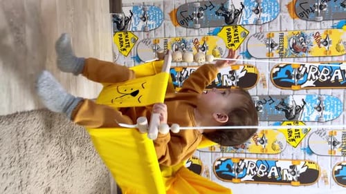 Happy Child Swinging Happily Indoors