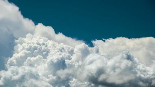 Timelapse of White Puffy Cumulus Clouds Forming on Summer Blue Sky Moving and Changing Cloudscape