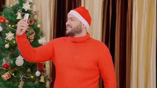 Man in Santa Hat Christmas Video Call