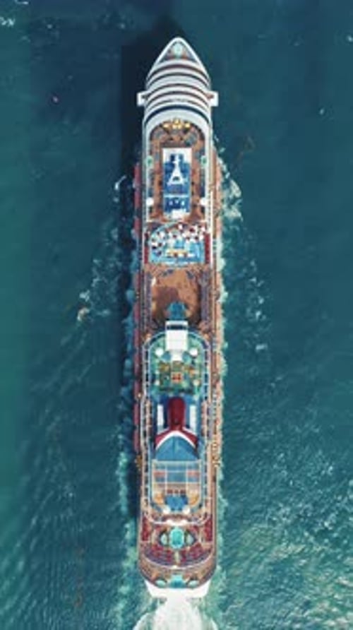 Vertical Video of a Cruise Ship From Above Highlighting the Ocean and Maritime Travel