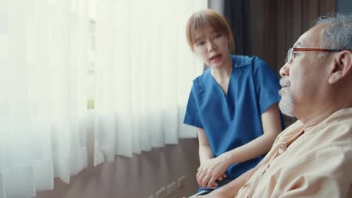 nurse lady support assist positive old guy patient sit on wheelchair at home or hospital.