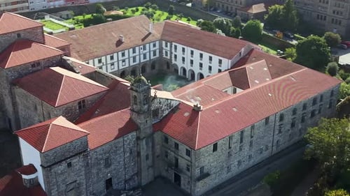 Aerial View of Historic European Monastery Courtyard with Red Tiled Roofs