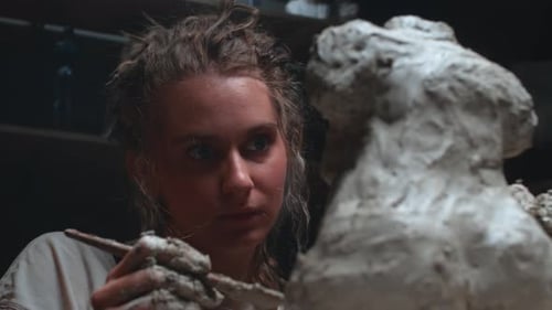 Woman Sculpting Clay Art in a Studio