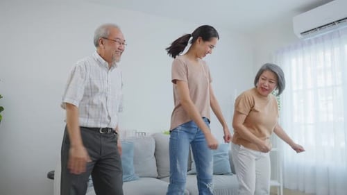 Family Fun: Three People Dancing at Home